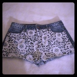 Forever 21 | Blue denim cutoff shorts with white lace overlay. Size 29.